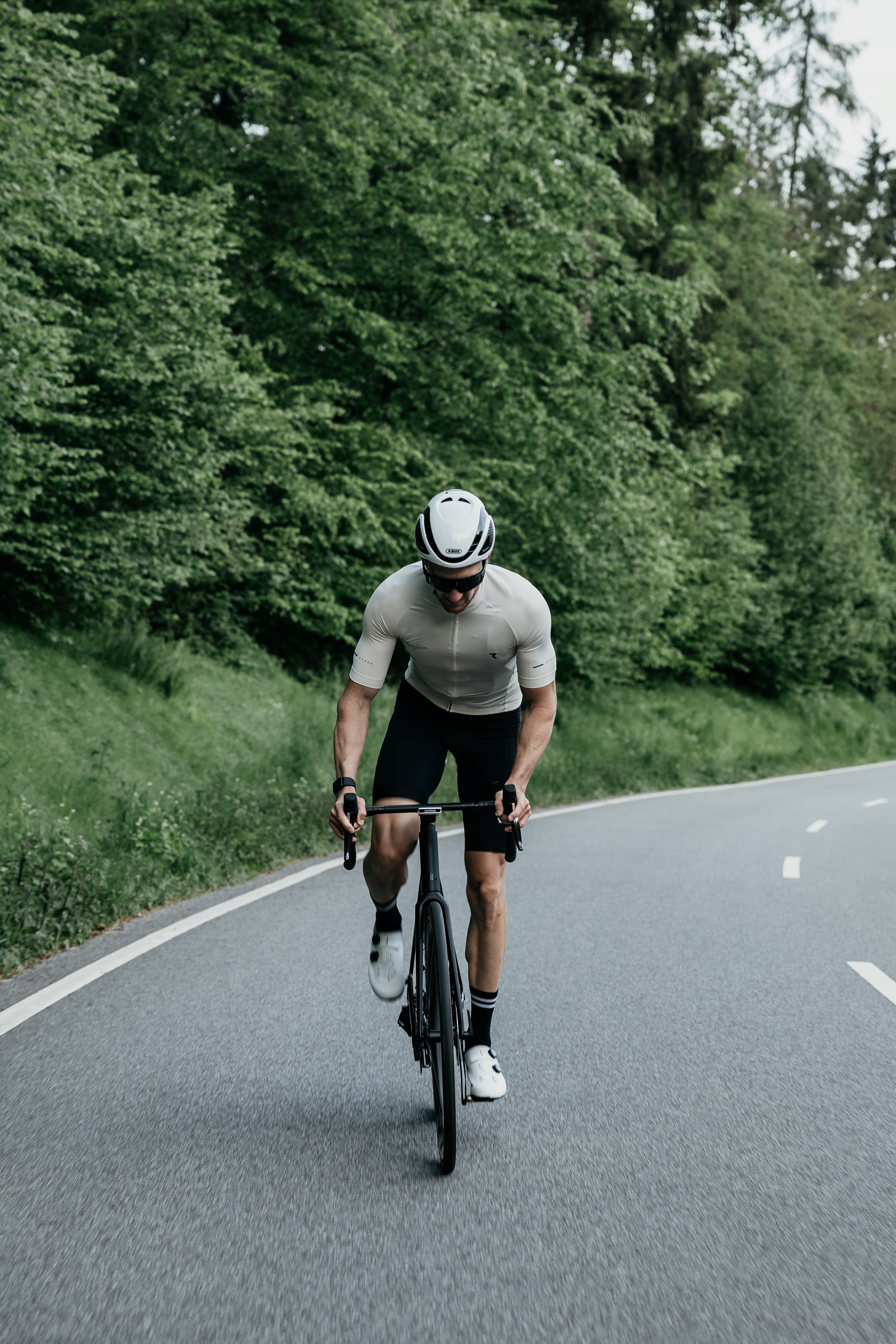 Kevin cycling through a forest road
